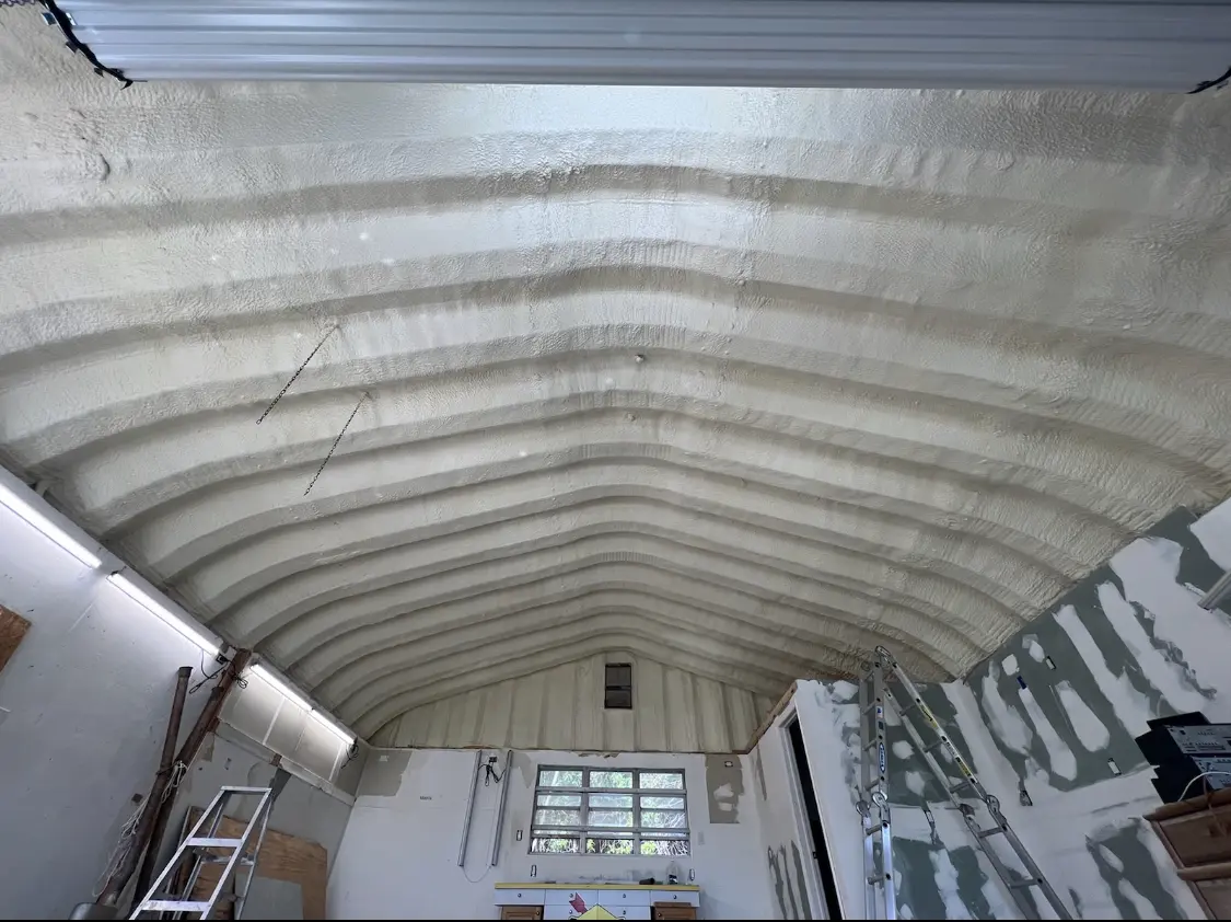 Spray polyurethane foam applied to the underside of a metal roof deck in Middle Valley